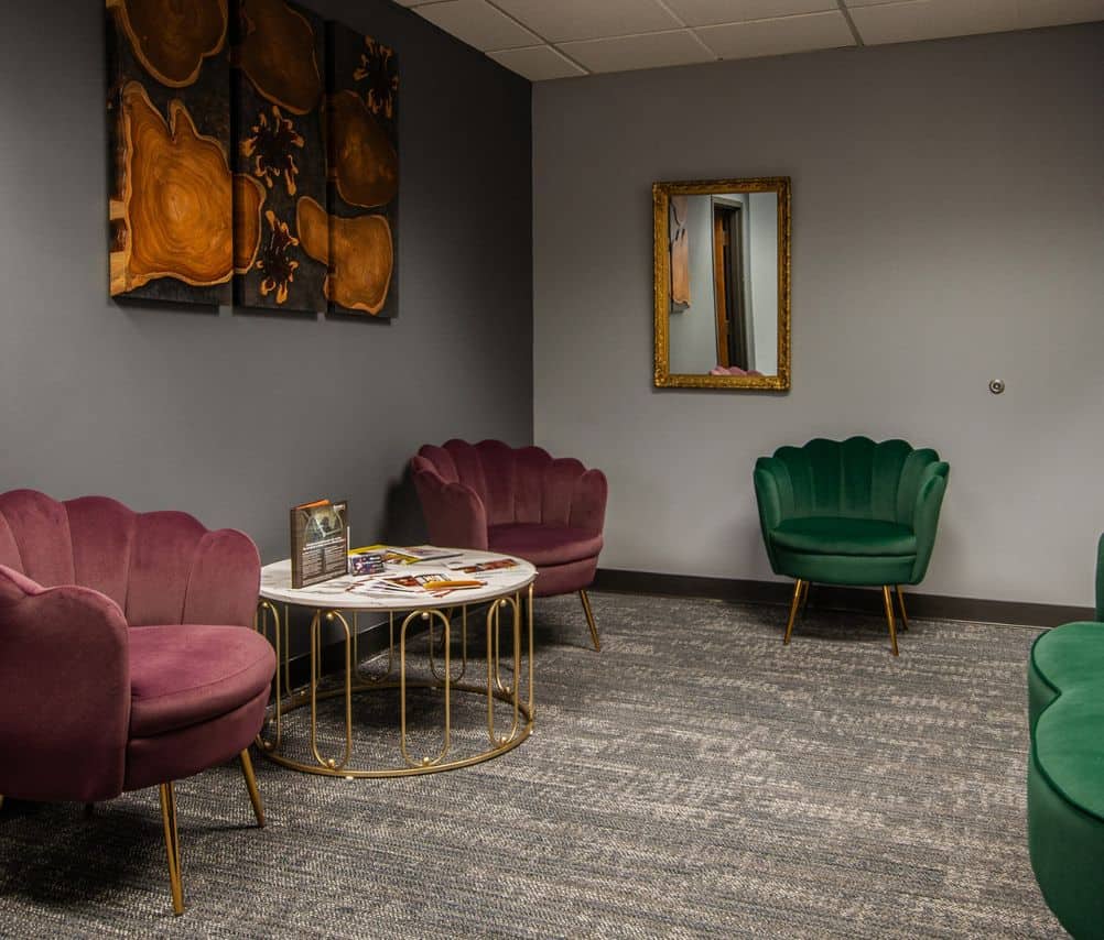 Room with green and red chairs